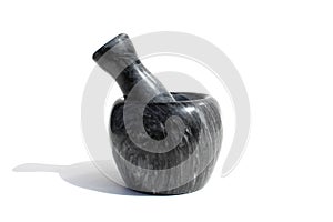 Black stone mortar with pestle stands on white background ÐžÐ¿Ð¸ÑÐ°Ð½Ð¸Ðµ